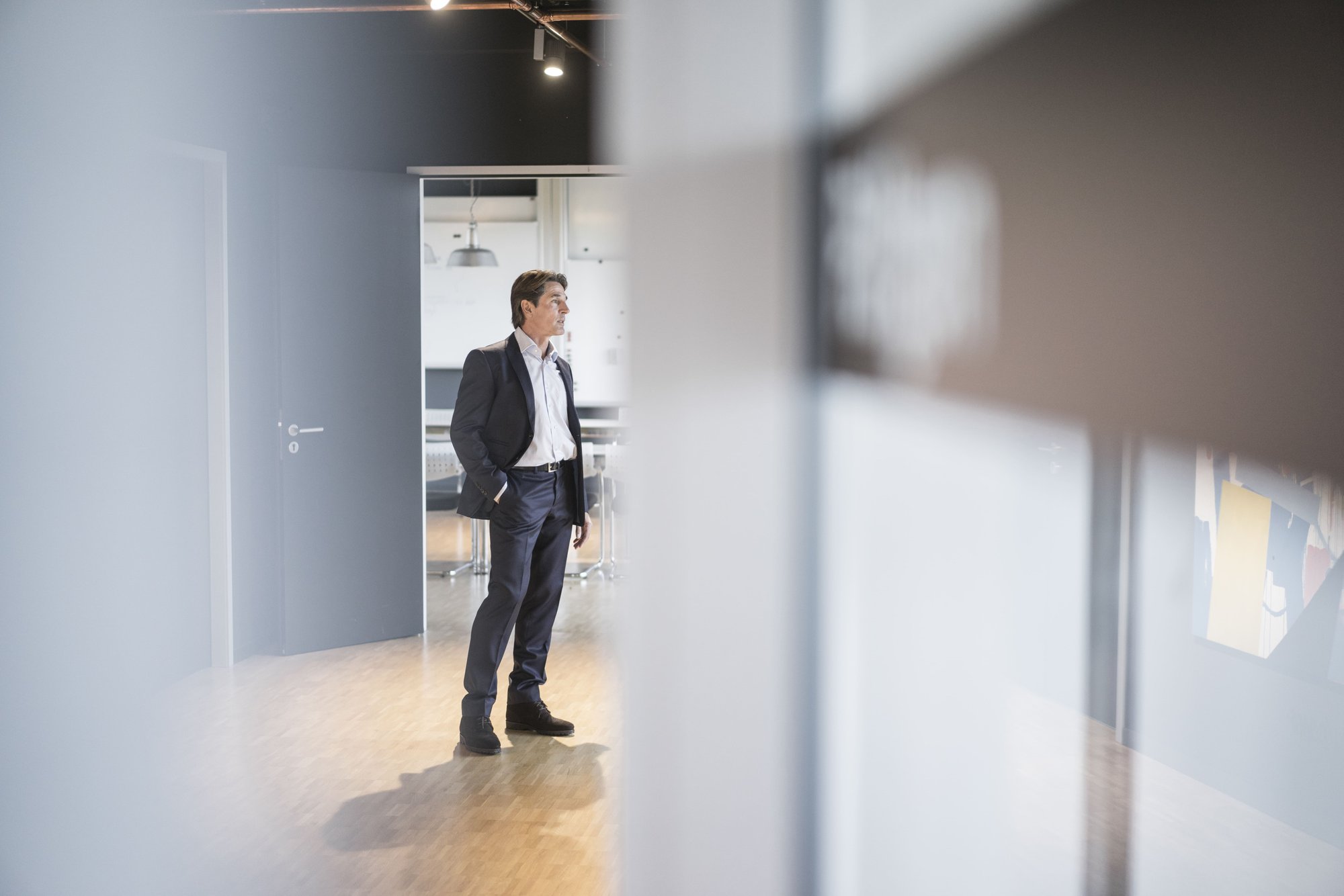 businessman-standing-on-office-floor-2026-01-05-00-59-02-utc