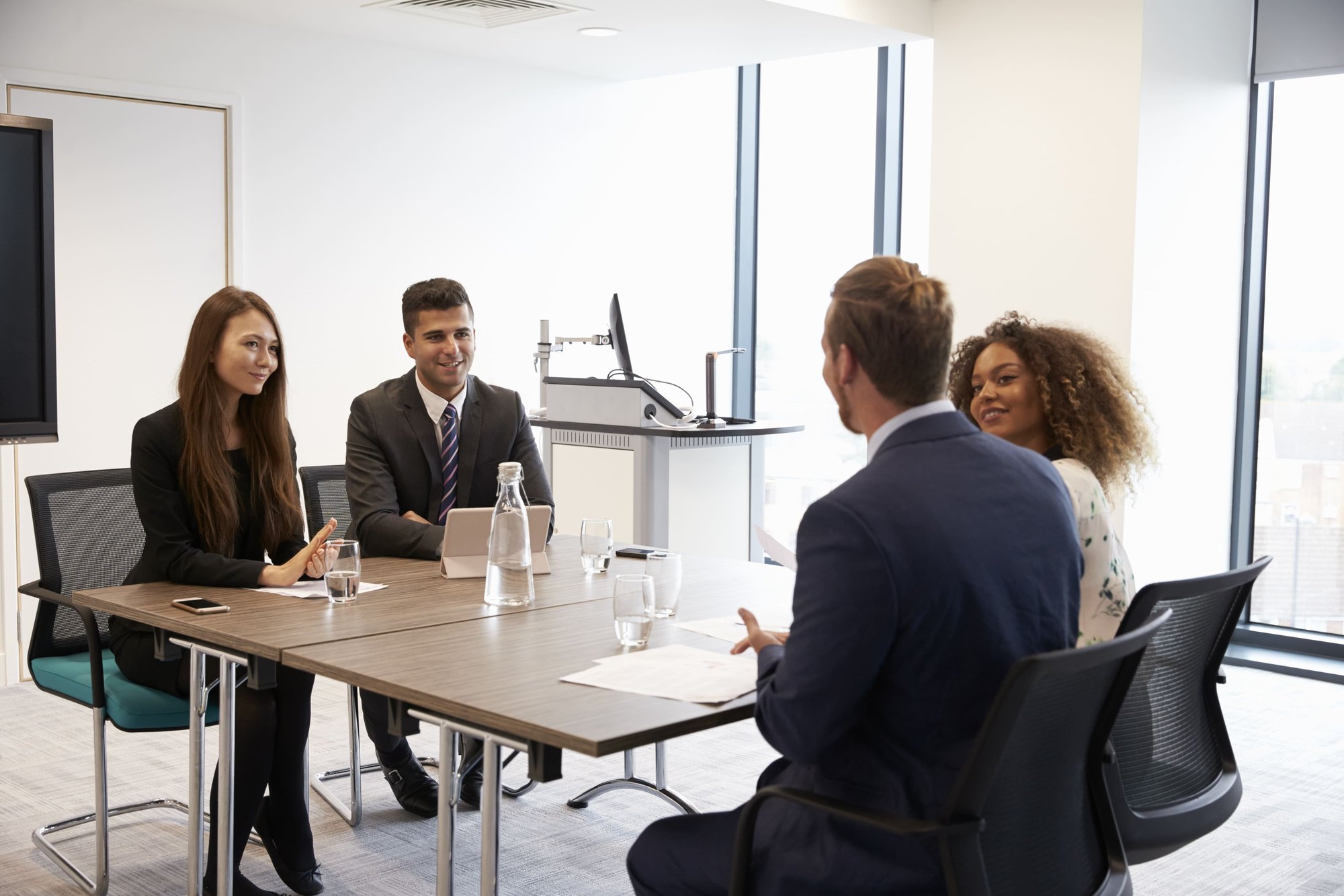 businesspeople-working-together-at-desk-in-modern-2026-01-05-06-29-29-utc (1)