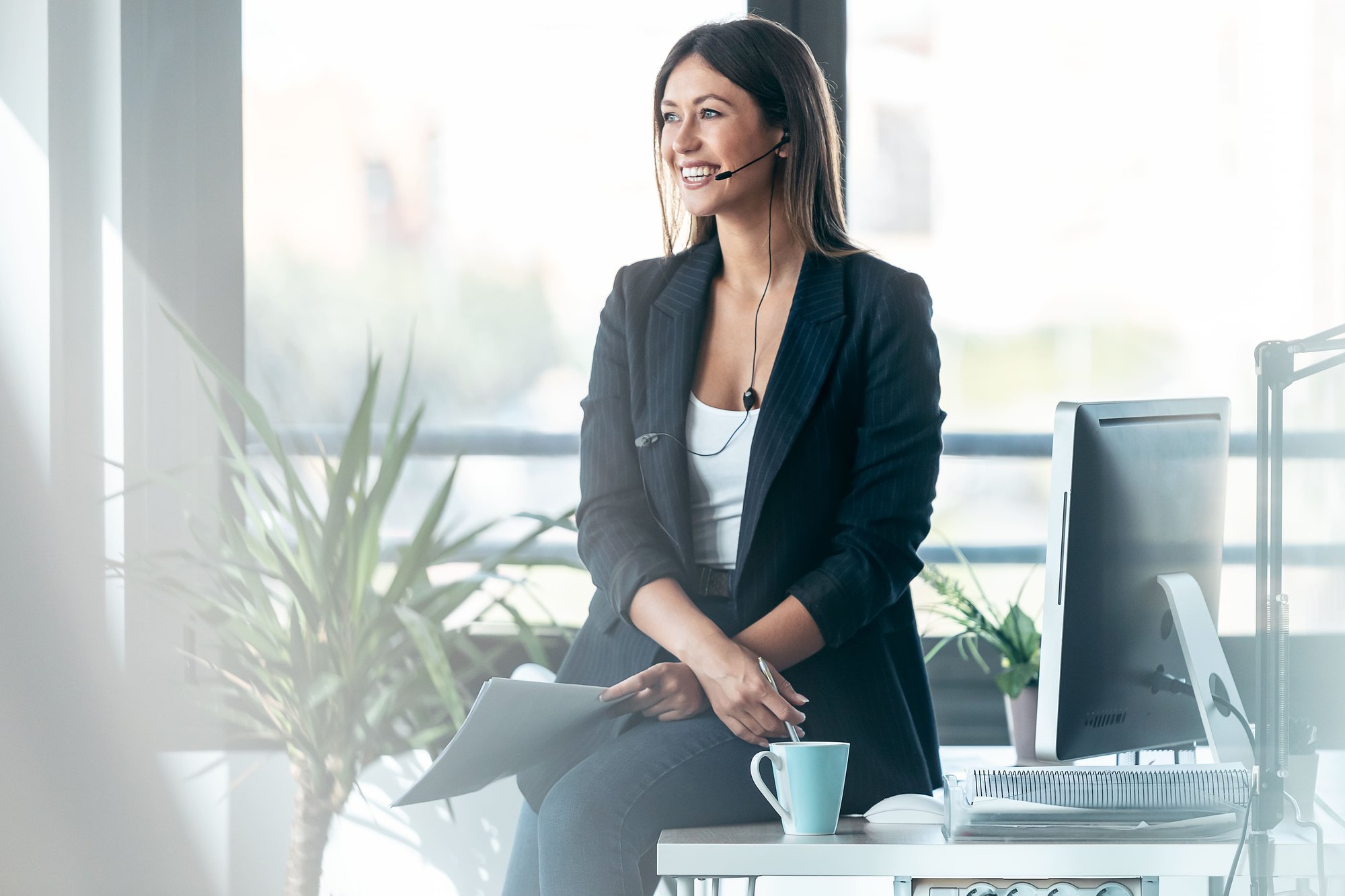 elegant-business-woman-talking-with-earphone-while-2026-03-09-05-14-46-utc
