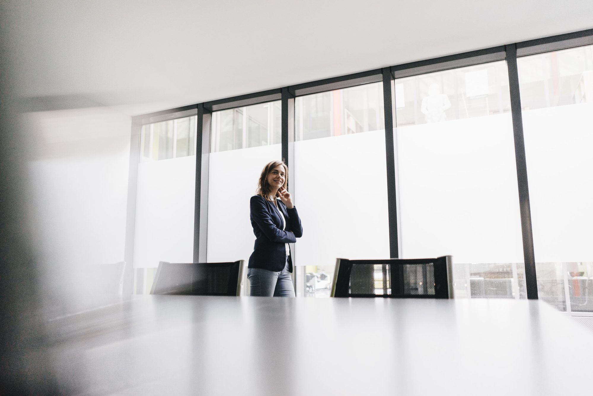 professional-woman-posing-near-conference-room-win-2026-01-05-00-37-20-utc