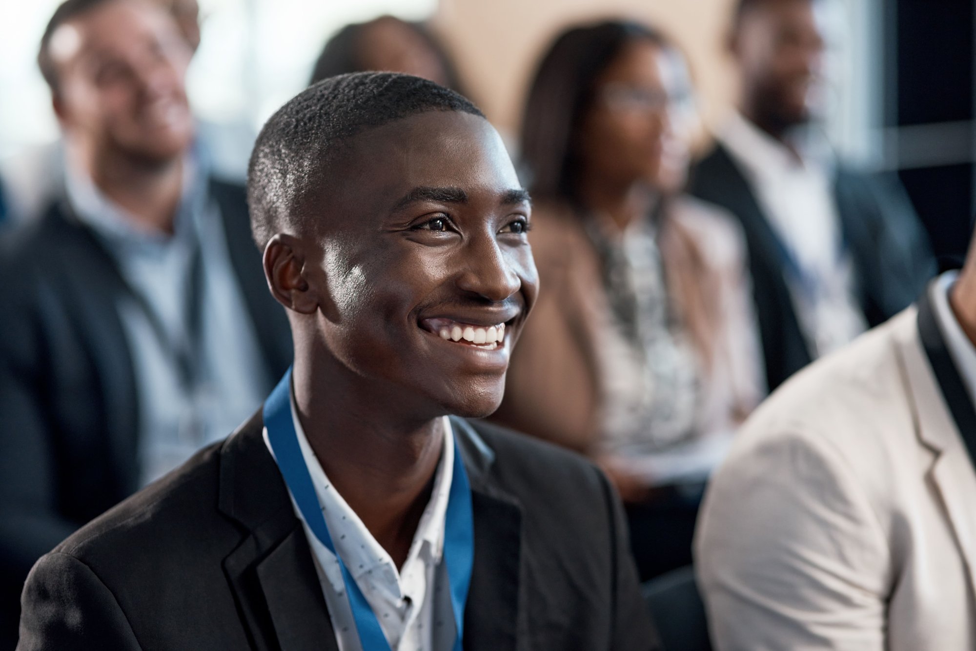 smiling-young-man-wearing-lanyard-attending-a-corp-2026-05-20-19-55-02-utc
