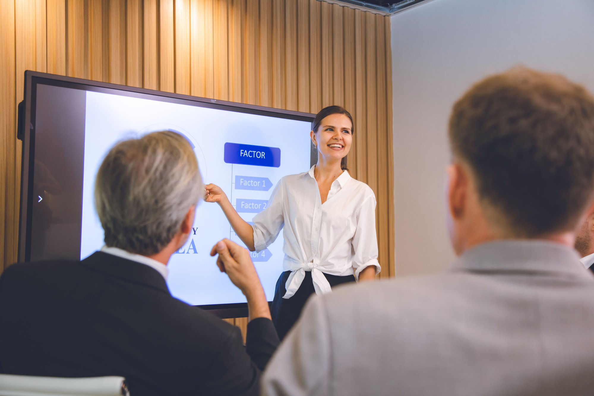woman-presenting-business-factors-to-colleagues-at-2026-01-05-00-34-42-utc